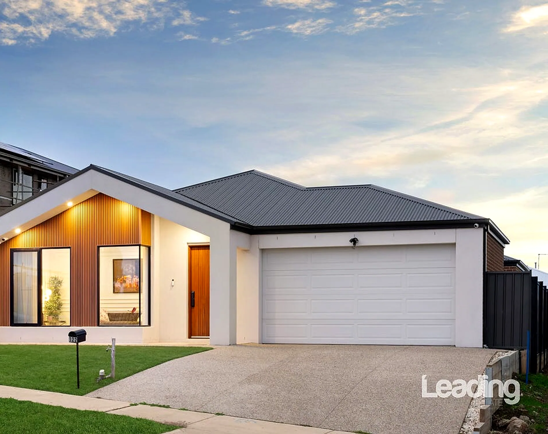 122 Elizabeth Drive, Sunbury at dusk — the contemporary façade lit against the evening sky